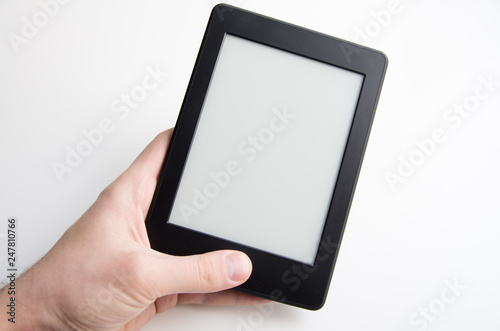 Bilde på lerret Hand holding blank ebook with blank screen