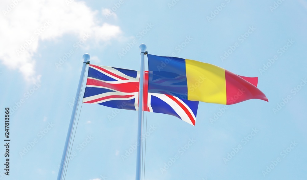 Romania and UK, two flags waving against blue sky. 3d image