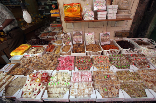 Candy shop in the souq of the Muslim Quarter in the Old City in Jerusalem, IL. Souqs are traditional middle eastern markets selling various foods and commodities. © zatletic