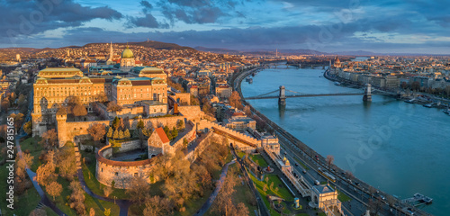 Budapest  Hungary - Aerial panoramic view of Buda Castle Royal Palace with Szechenyi Chain Bridge  Parliament and colorful clouds at sunrise