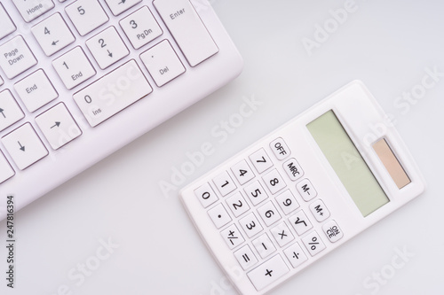  Calculator, computer keyboard and fountain pen