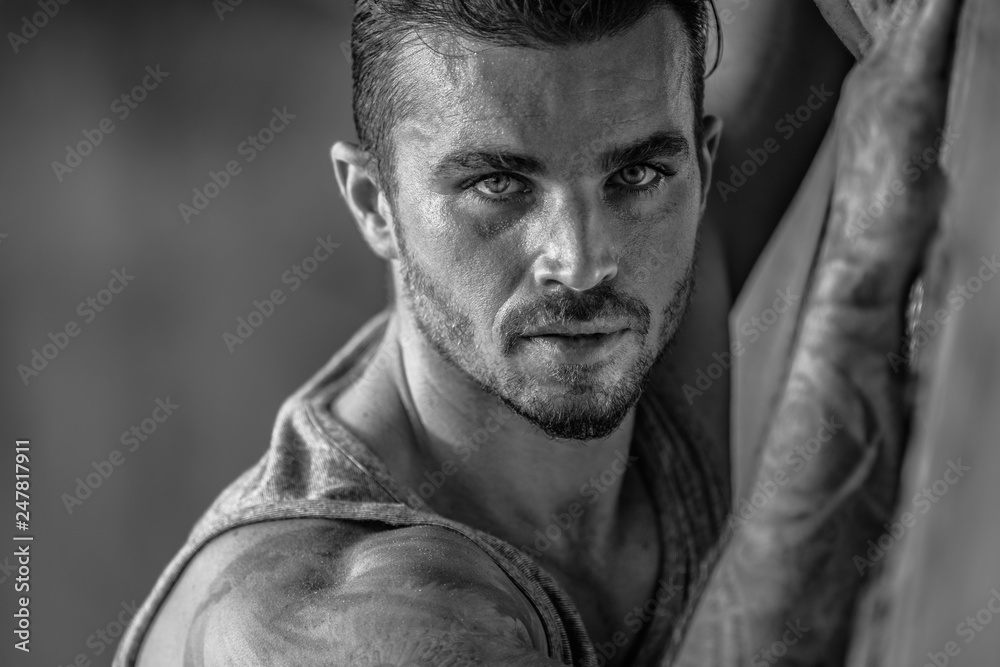 Fototapeta premium Portrait of a handsome caucasian male model posing on the beach