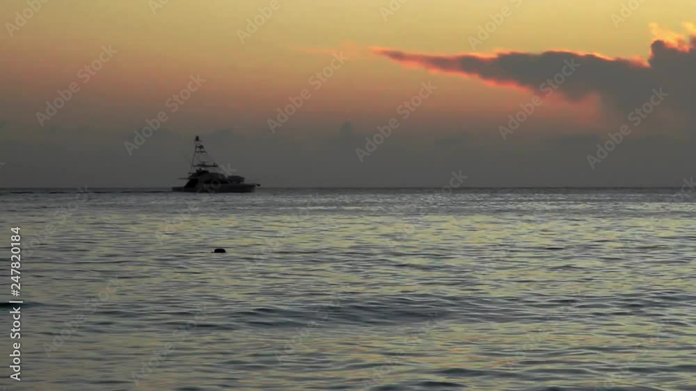 Yatch silhouette in caribbean red sunset Yatch silhouette in caribbean red sunset