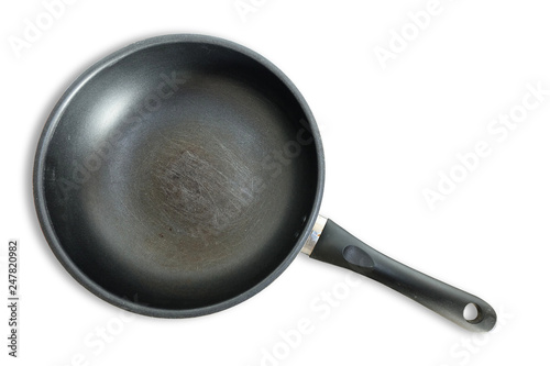 Scratches on the old teflon frying pan isolate on white background