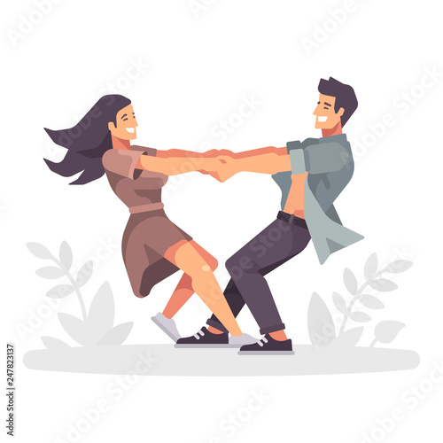 Romantic young couple holing hands and spinning around, forming a heart shape