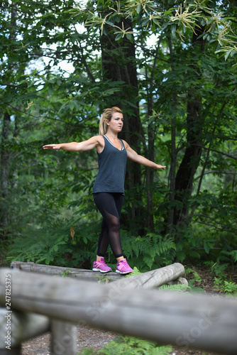 young active woman in a fitness trail