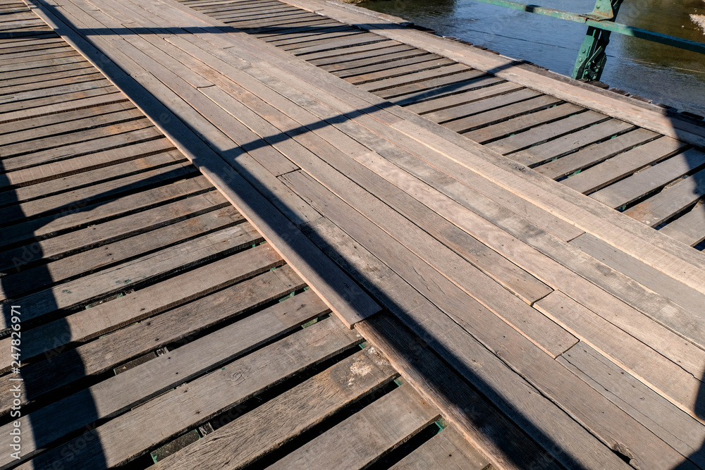 wooden and old steel bridge make room for cargo pass at Pai Mae Hong Son Thailand