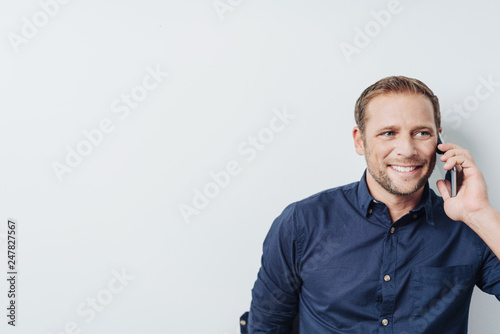 Man talking by the phone. Portrait with copy space