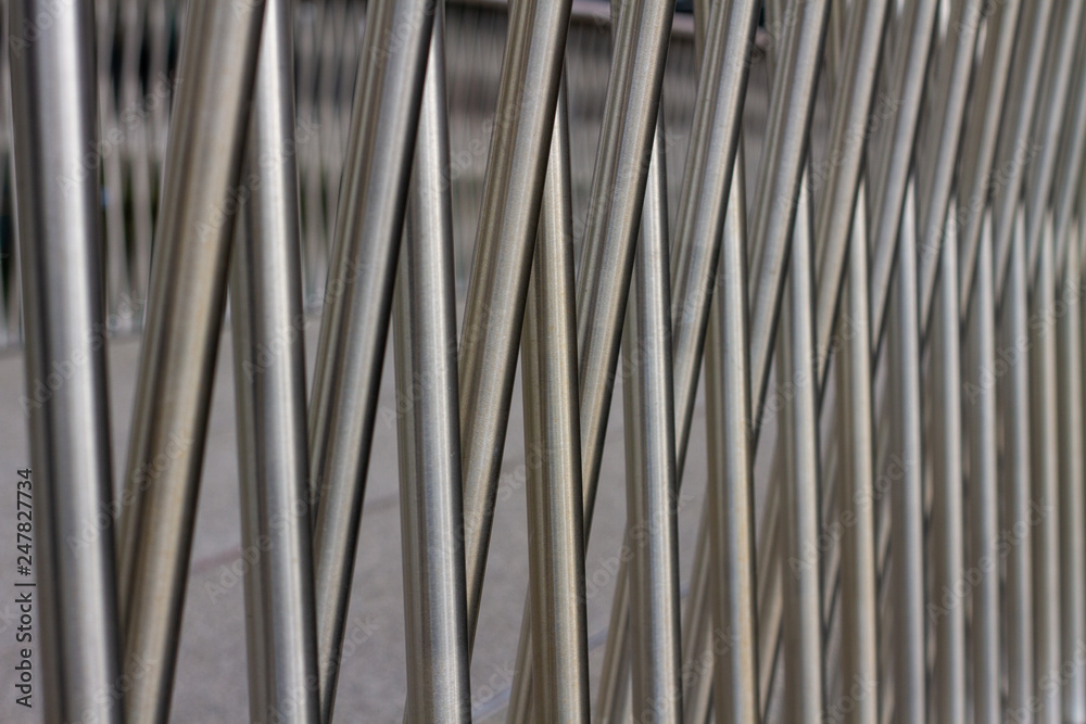 Brushed aluminium metal bars crossing eachother diagonally Brushed aluminium metal bars crossing eachother diagonally