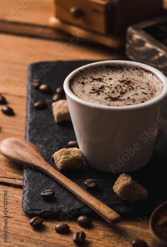 Black coffee with milk flatlay view on wooden background
