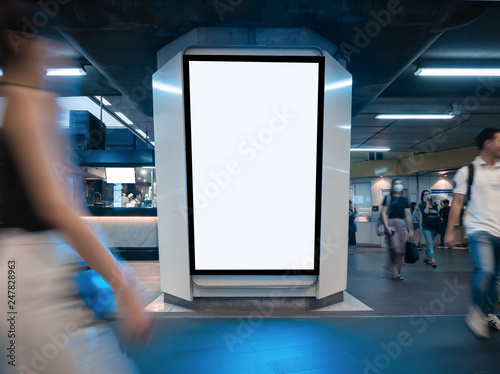 Mock up blank billboard white LED screen vertical for advertising on sky walk in Bangkok. Public building People walking.