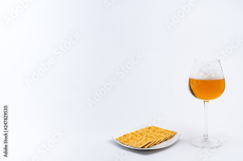 Alcoholic drinks such as wine or beer and variable colorful side dish such as vegetables or fruites surrounded clean white wall for the celebration of anniversary day.