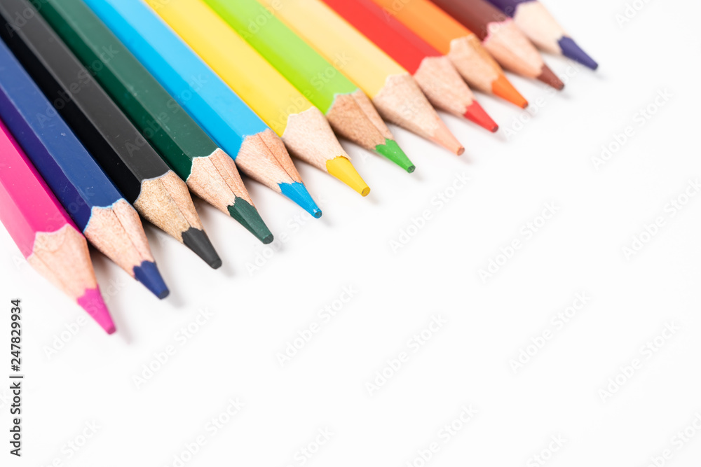 many colored pencils on white background many colored pencils on white background