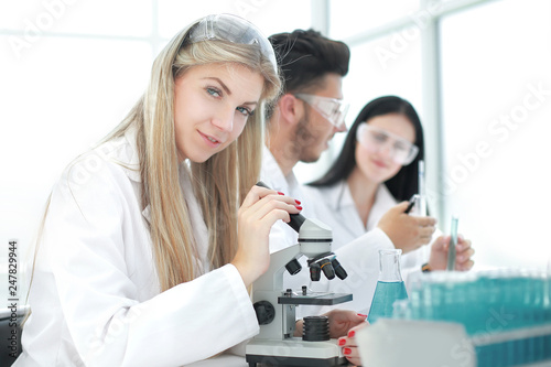 close up. a group of scientists conduct research in a modern laboratory