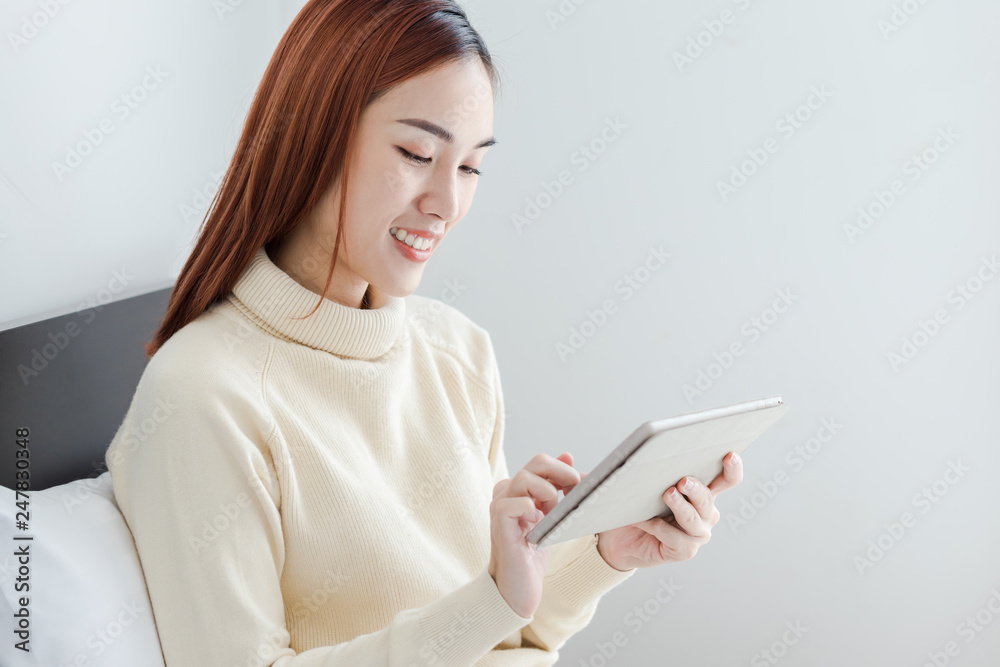 Attractive business woman use computer tablet to see her online store Attractive business woman use computer tablet to see her online store