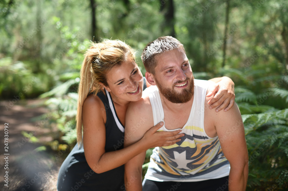 Fototapeta premium couple exercising in a wood