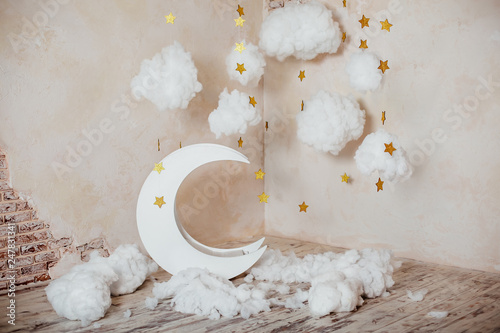 Children's location for a photo shoot. Moon with stars and clouds. Dreamy decor. Elements of the interior.