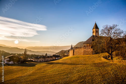 Great view of alpine church at sunset  Dolomites Alps  South Tyrol  Italy  Europe. Scenic image of beautiful nature landscape. Discover the beauty of earth
