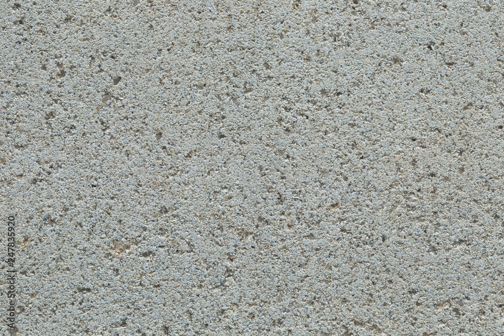 The surface texture of the brick is composed of fine sand, close-up, macro. Texture of Lightweight concrete block the bricks used in the construction. The surface texture of the brick is composed of fine sand, close-up, macro. Texture of Lightweight concrete block the bricks used in the construction.