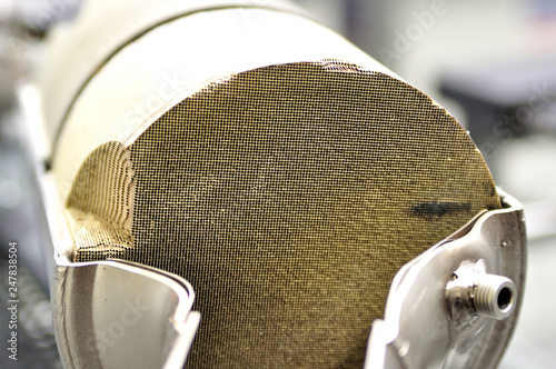 Konstfotografi cross section of a new clean car catalyst wits selective focus.