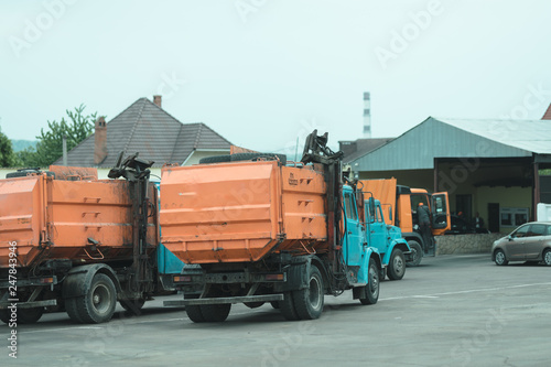trash truck or dump-truck municipality sanitation salubrity truck fleet of city vehicles for urban garbage collector service with retro car transportation for sanitation services to city residents
