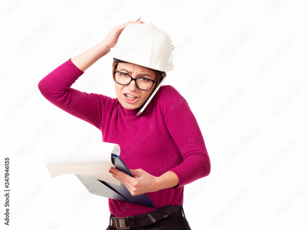 Emotional girl brigadier in a white helmet with glasses and a folder in his hands on a white background Emotional girl brigadier in a white helmet with glasses and a folder in his hands on a white background