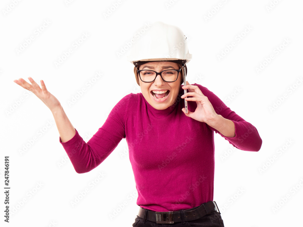 Emotional girl brigadier in a white helmet with glasses and a folder in his hands on a white background Emotional girl brigadier in a white helmet with glasses and a folder in his hands on a white background
