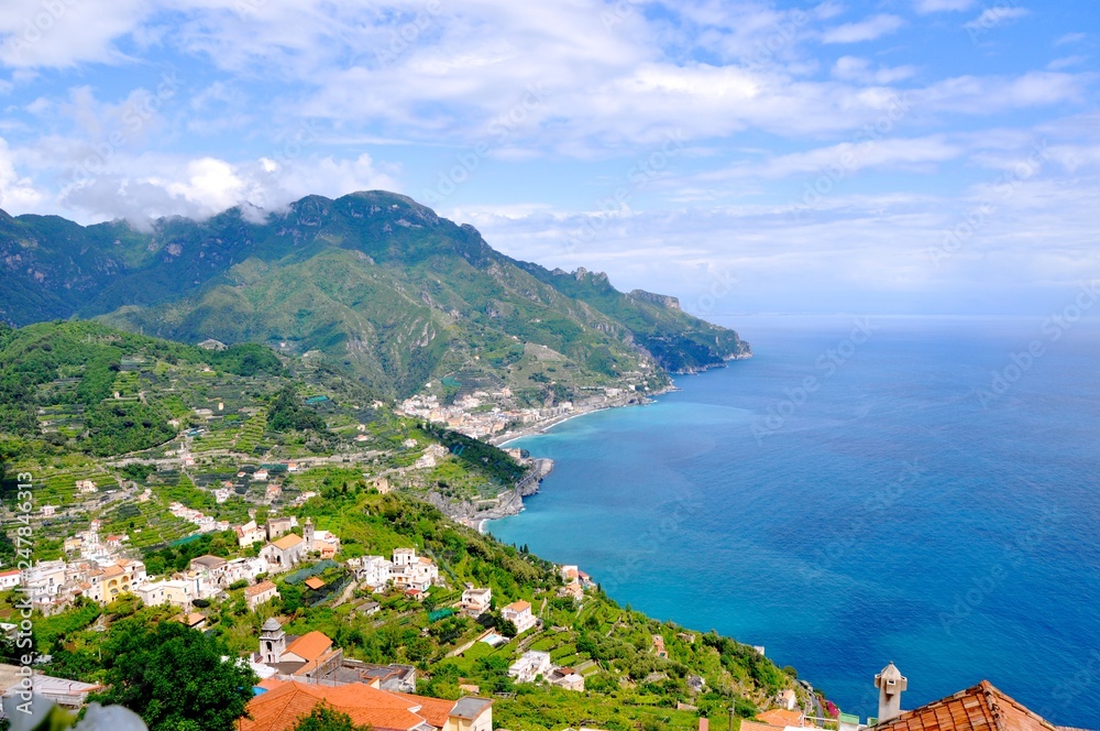 Beautiful coast line in Italy with bright sky and clouds