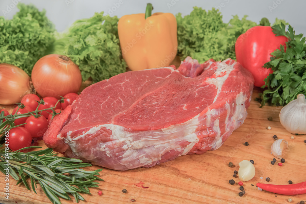 Juicy raw meat, beef entrecote on black background, top view Juicy raw meat, beef entrecote on black background, top view