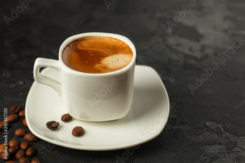 coffee freshly brewed in a white cup serving of beverage (coffee grain). food. top.copy save