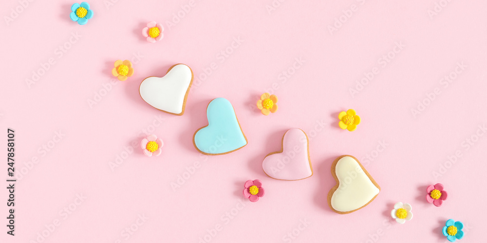 Composition Valentine's Day. Valentine cookies in shape heart on pastel pink background. Flat lay, top view, copy space