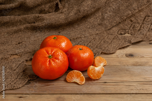 citrus mandarins on a wooden Board and an old grandma's handkerchief, from Russia