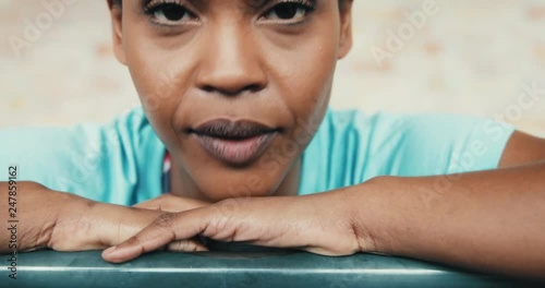 Focused young African American woman preparing for a gym workout photo