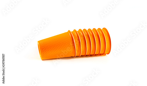 Orange Plastic Cups are stacked one by one