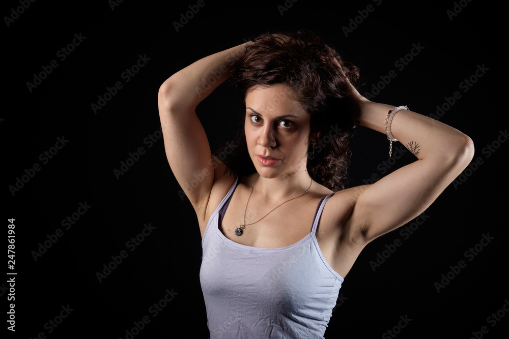 closeup portrait of a beautiful young woman with back background and copy space
