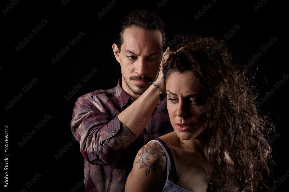 man threatening a scared woman in a gender violence case between a young couple arguing and struggling man threatening a scared woman in a gender violence case between a young couple arguing and struggling