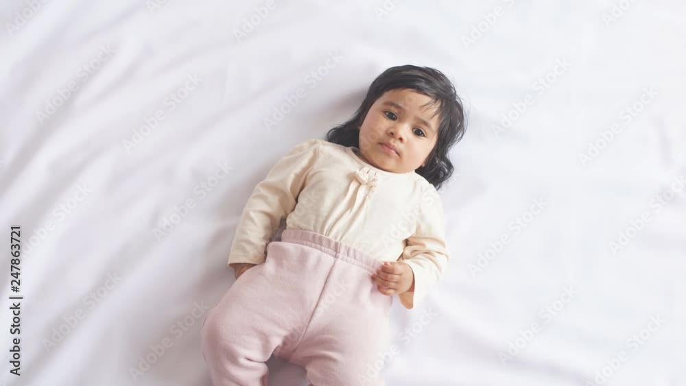 Happy African American Baby Girl Lying on Blanket at Home. Happy African American Baby Girl Lying on Blanket at Home.