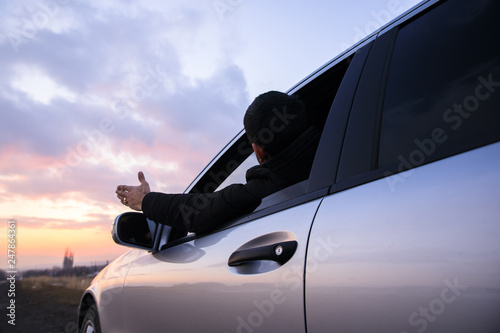 angry man hand in car window