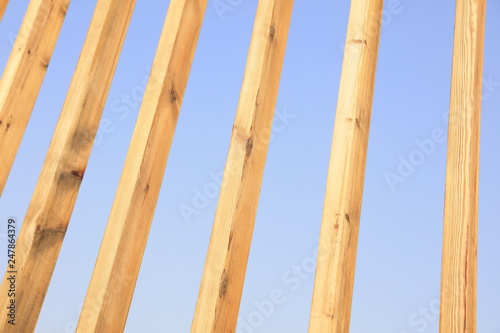 Stakes in blue sky background