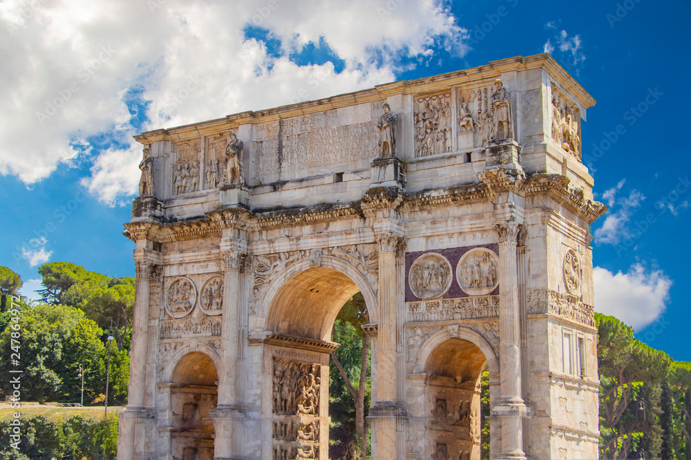 View of the Arch of Constantine and the Colosseum in the morning sun.