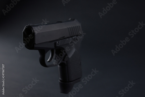 Hand gun on black background