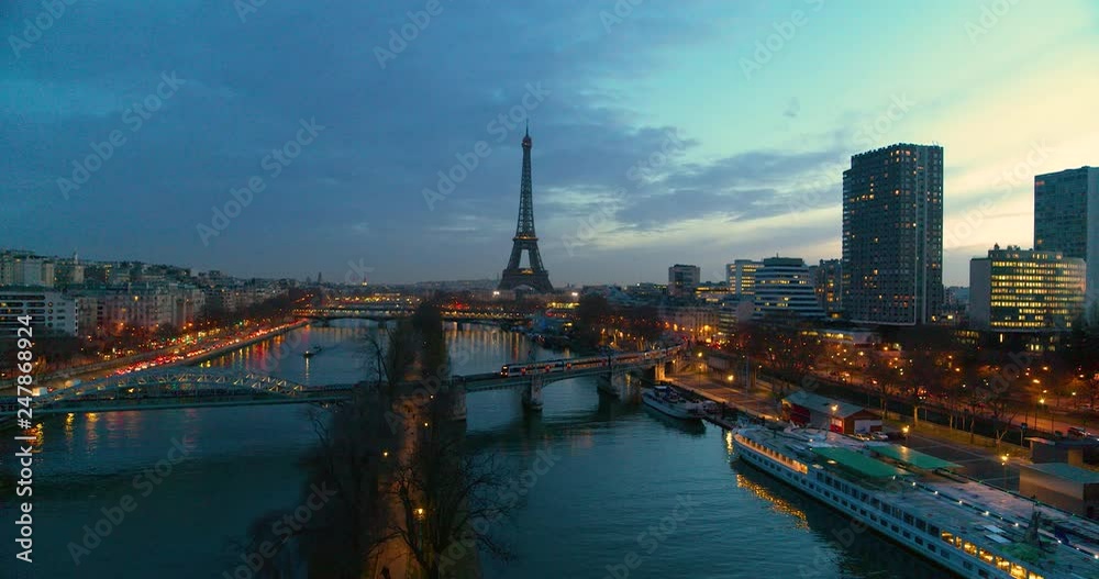 Drone shot of the Eiffel Tower and its surroundings at dusk