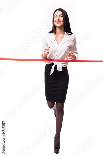 Happy running businesswoman crossing finish line isolated on white background
