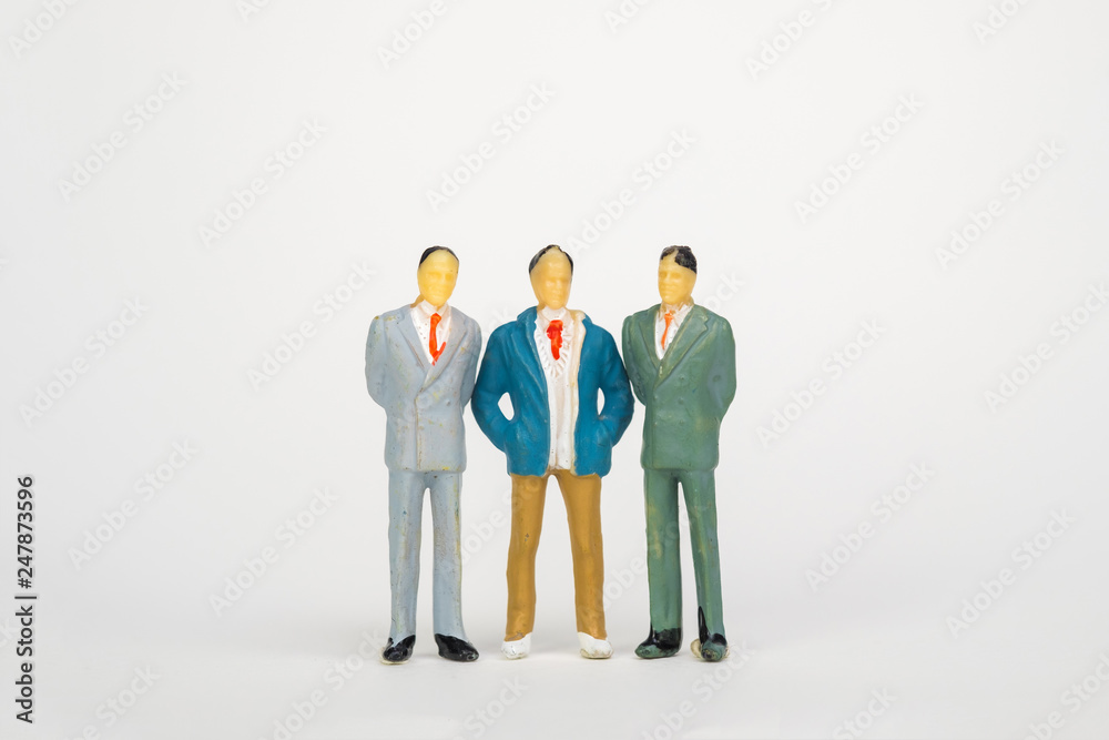 Group of figure miniature businessman or small people investor and office worker secretary on white background for money and financial business teamwork concept. Group of figure miniature businessman or small people investor and office worker secretary on white background for money and financial business teamwork concept.