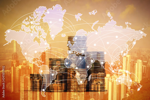 Double exposure of coin stack with city background and world map, financial graph, world map and global network business concept.