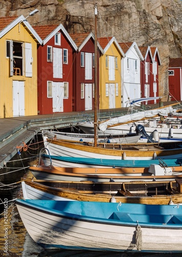 Boats and colourful boathouses in the harbour of Smogen, Smogenbryggan, Vastra Gotalands Lan, Bohuslan, Sweden, Europe photo