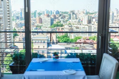table in a restaurant overlooking the city