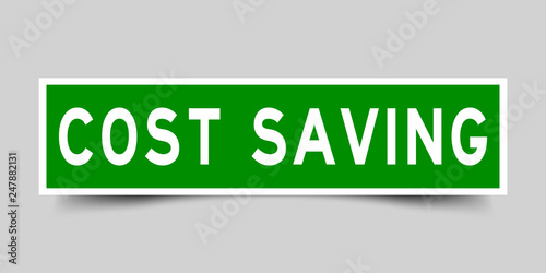 Square green color sticker with word cost saving on gray background