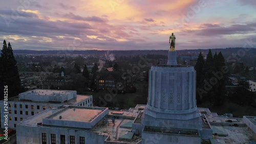 Dawn Sun Shines Through Clouds at The State Capital Building in Salem
