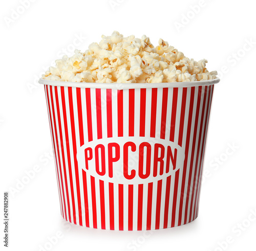 Bucket with fresh tasty popcorn isolated on white. Cinema snack
